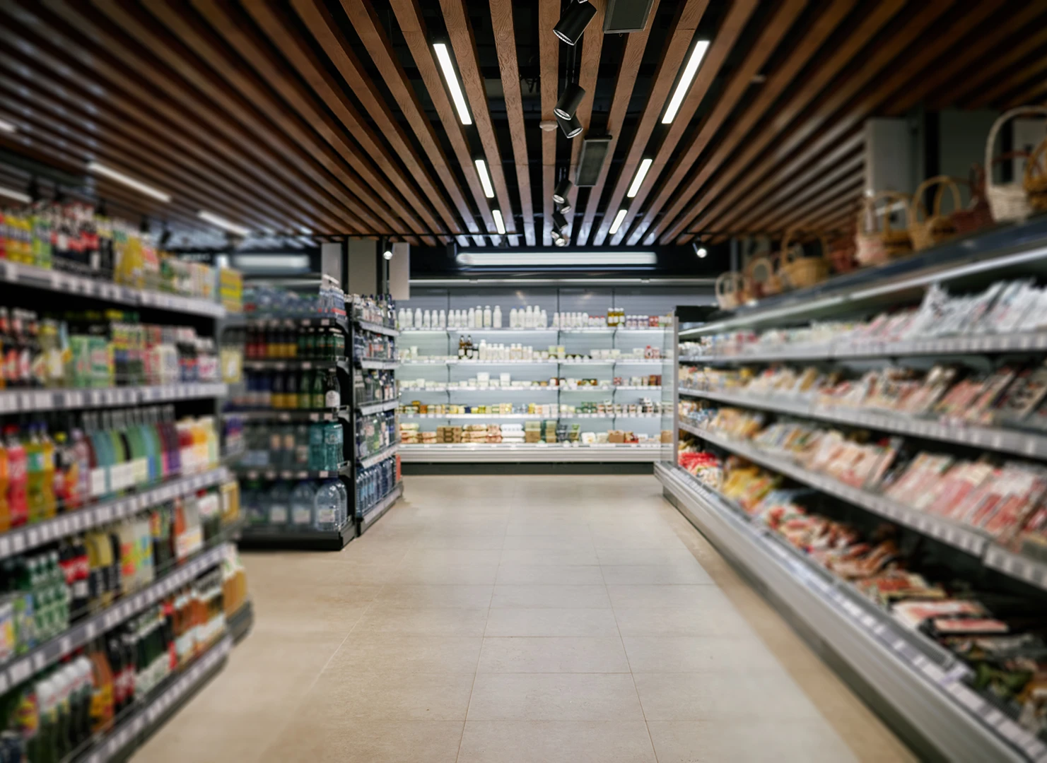 Supermarket aisle with shelves of products.